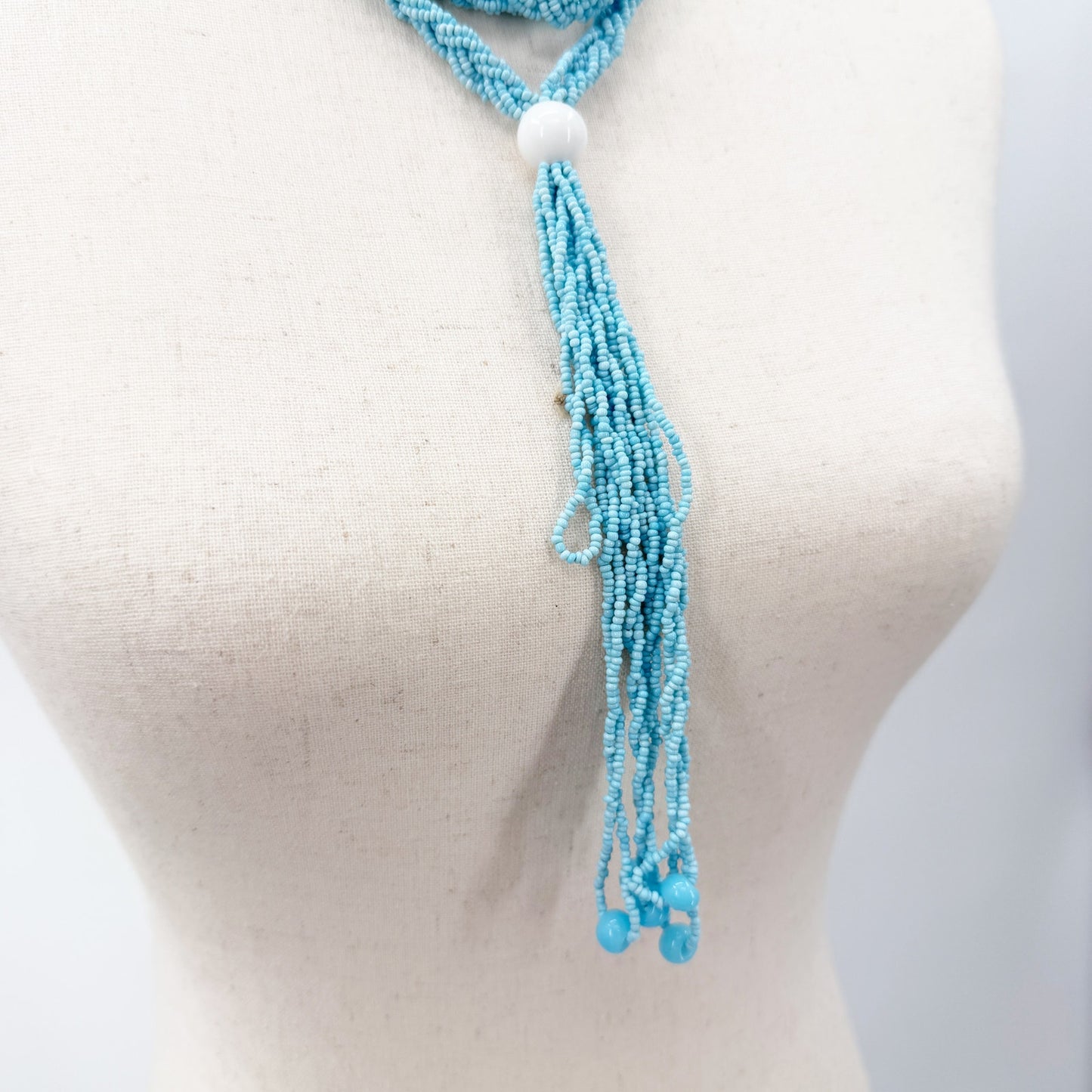 vintage Necklace of turquoise blue seed beads & tassel pendant long 28" drop